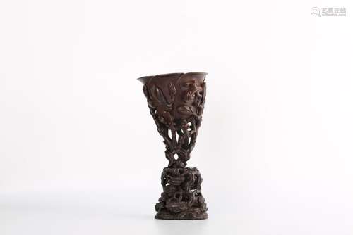 A CARVED AGALLOCH WOOD 'DRAGON' CUP AND STAND.ANTIQUE