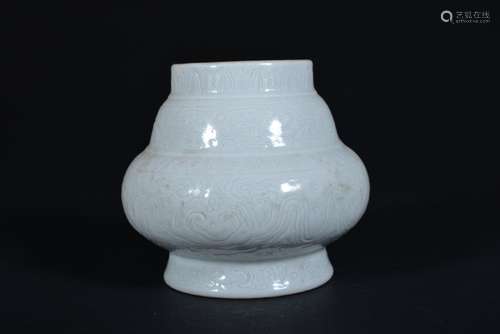 A CARVED WHITE-GLAZED JAR, QING DYNASTY