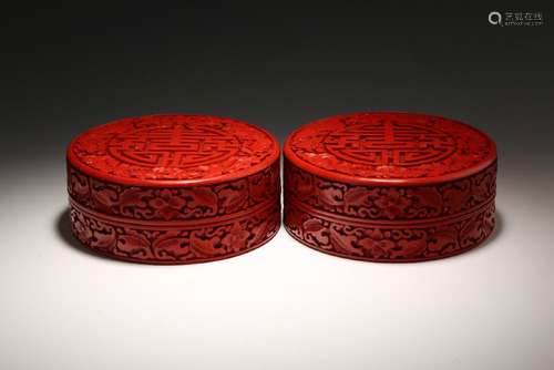 A PAIR OF CARVED CINNABAR LACQUER 'SHOU' BOX AND