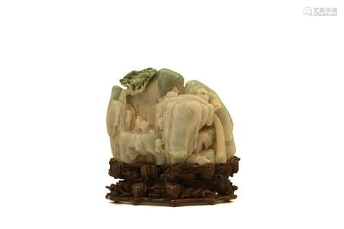 A CARVED JADEITE 'LANDSCAPE' BOULDER.ANTIQUE