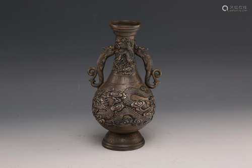 A CARVED SILVER VASE.ANTIQUE