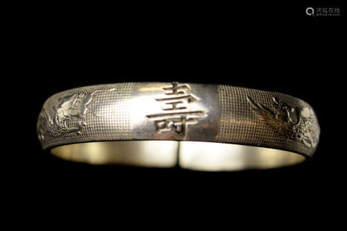 An Old Chinese Silver Bracelet with Dragon and Phoenix Design