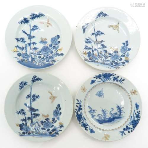 A Collection of Four Blue and White Decor Plates