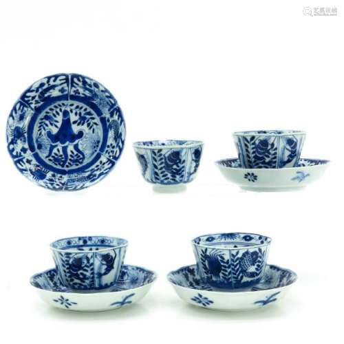 A Series of Four Blue and White Cups and Saucers