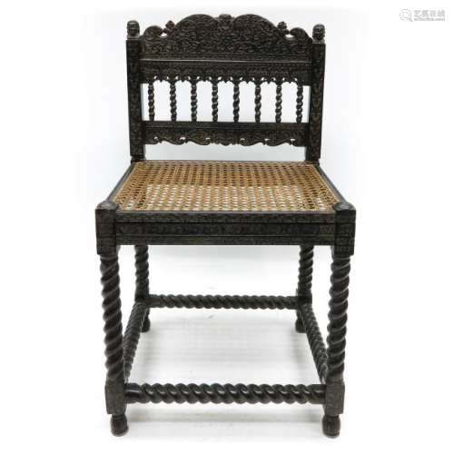 A Rare 17th Century Carved Ebony Arm Chair