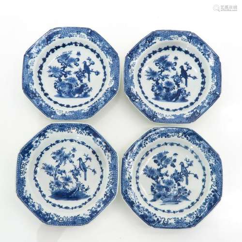 Four Blue and White Plates