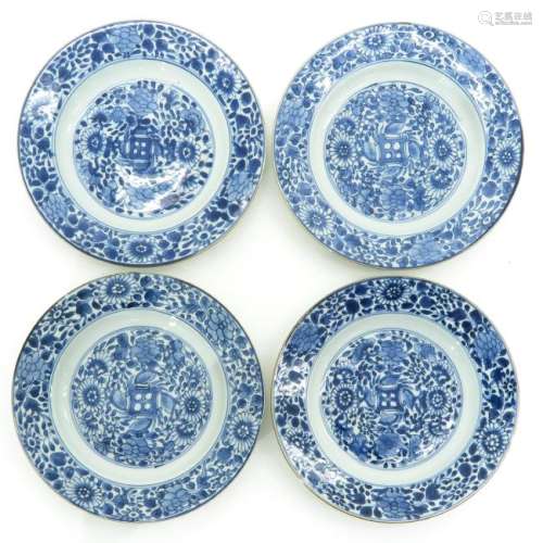 A Series of Four Blue and White Decor Plates