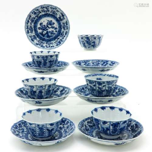 A Series of Blue and White Cups and Saucers
