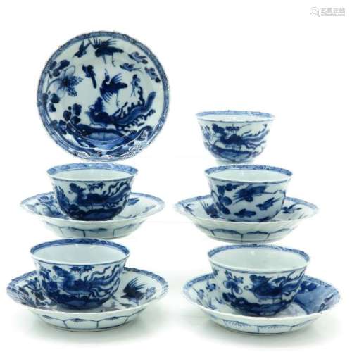 A Series of Five Blue and White Cups and Saucers