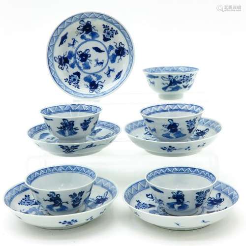 A Series of Five Blue and White Cups and Saucers