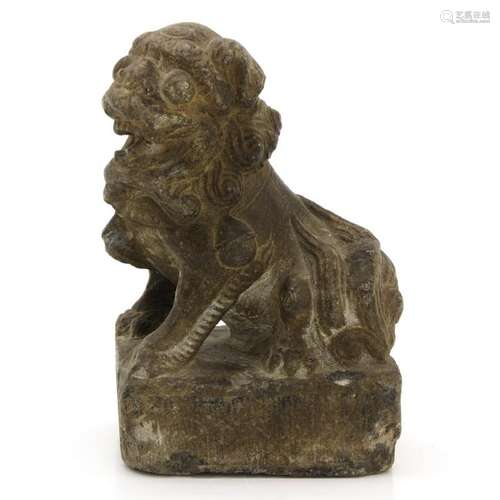 A Carved Stone Temple Lion Sculpture