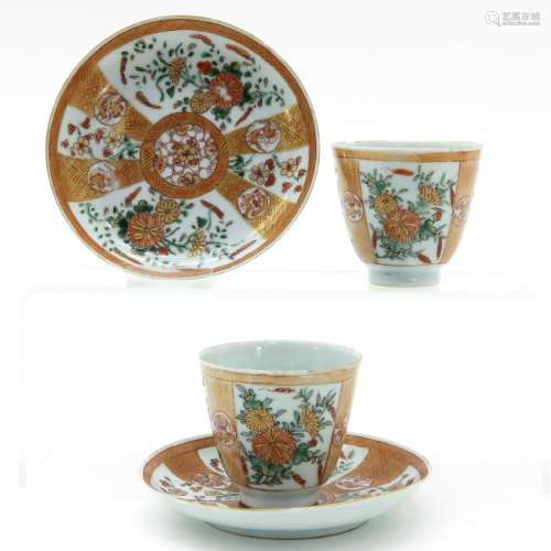 A Pair of Polychrome Decor Cups and Saucers