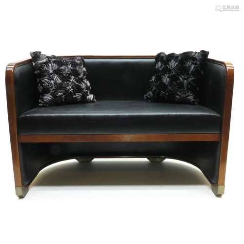 An Art Decor Mahogany Love Seat