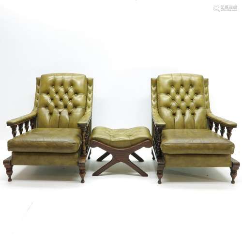 A Pair of Leather Fauteuils with Ottoman