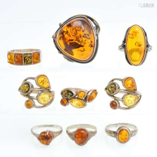 A Collection of 9 Silver Rings with Amber