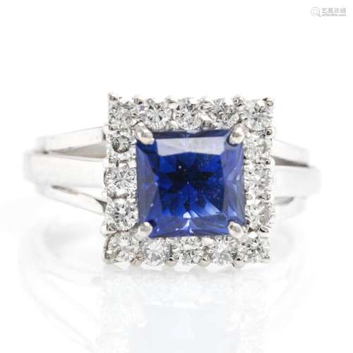 An 18KWG Ladies Diamond and Princess Cut Sapphire Ring