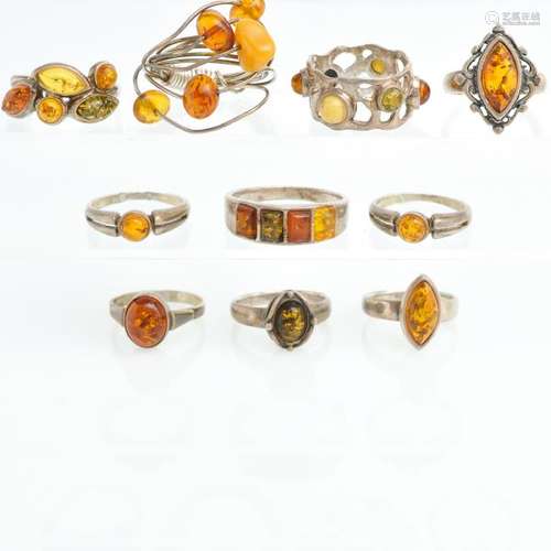 A Collection of 10 Silver and Amber Rings