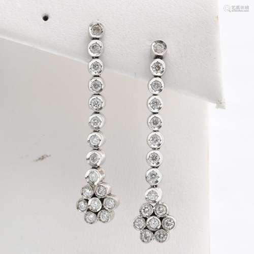 A Pair of 18KWG Diamond Drop Earrings