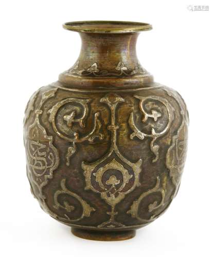 An Islamic copper vase