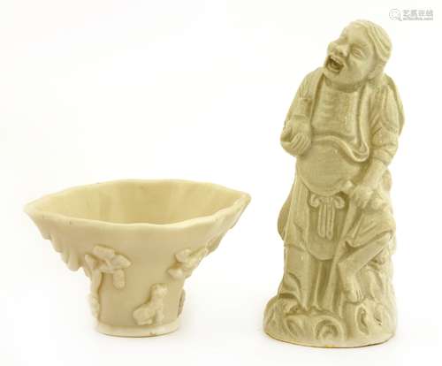 A Chinese blanc de Chine wine cup and a figure