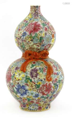 A Chinese famille rose millefleur vase