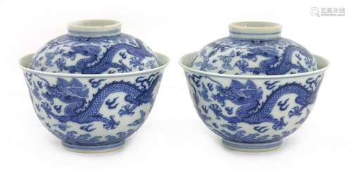 A pair of Chinese blue and white bowls and covers