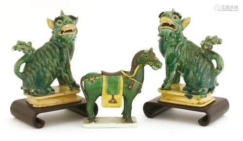 A pair of Chinese sancai Buddhist lions and a horse