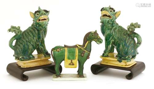 A pair of Chinese sancai Buddhist lions and a horse