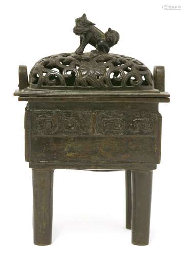 A Chinese bronze incense burner and cover