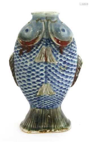 A Chinese blue and white twin fish vase