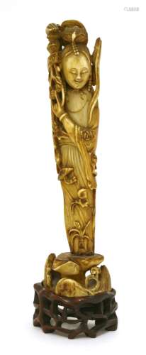 An ivory figure of the heavenly maid scattering blossoms