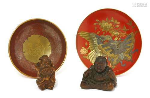 Two Japanese wood netsuke and two lacquered dishes