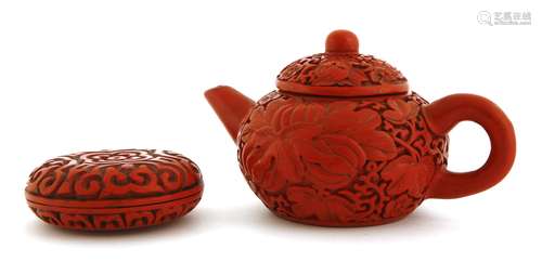 A Chinese lacquered Yixing teapot