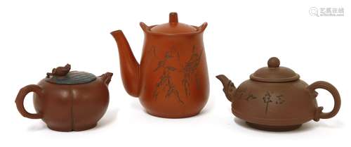 A collection of three Yixing teapots