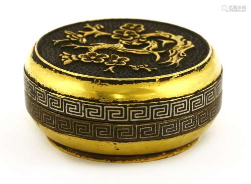 A Chinese parcel-gilt bronze incense powder box and cover