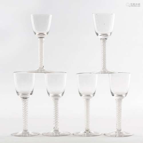 A set of six glasses with twisted opaque stems