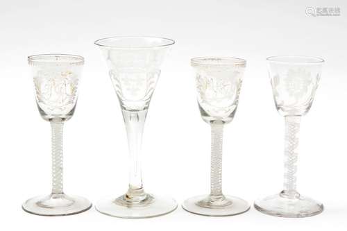 Four engraved glasses, three with twisted opaque stems