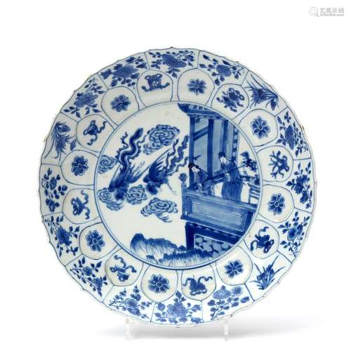 A blue & white plate with figures on a balcony