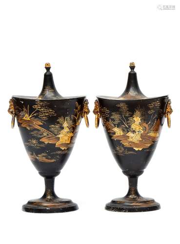 A pair of black and gilt tole peinte chestnut urns with chinoiserie decor