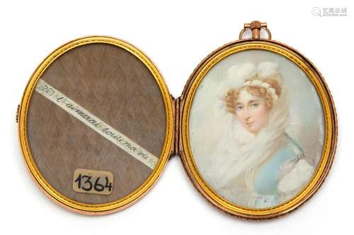 A portrait miniature of a lady in a blue dress