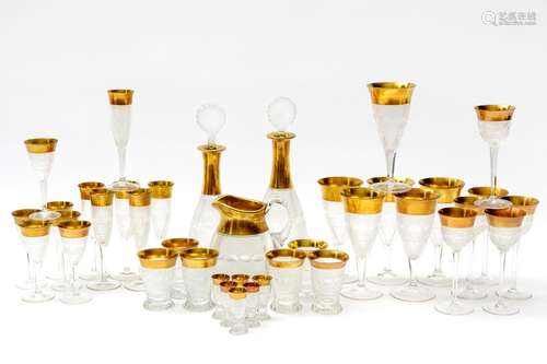 A full Moser Splendid Gold crystal glass service