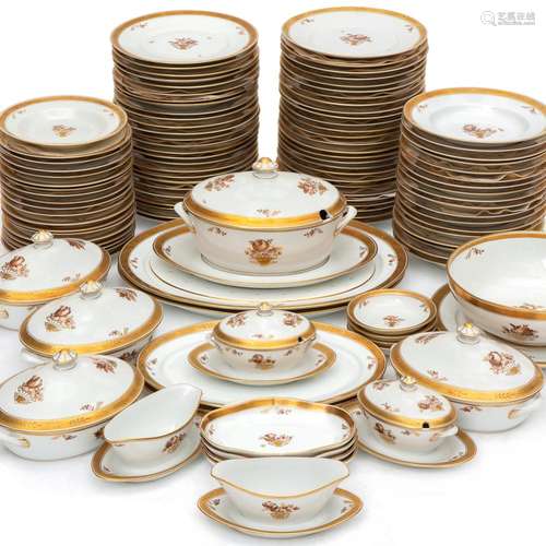 An extensive porcelain dinner service brown floral with gilding