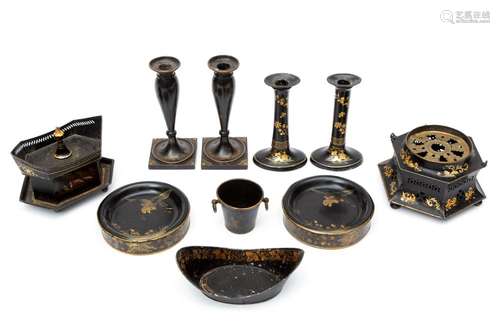 A collection of black and gilt tole peinte objects