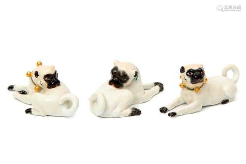 Three Meissen porcelain pug dog figures