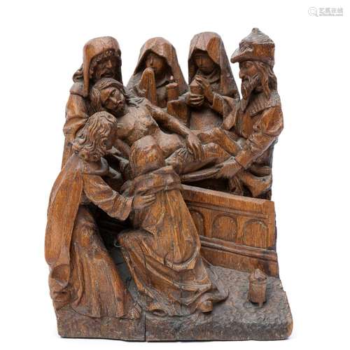 An oak wooden carved sculpture of Christ's descent from the Cross