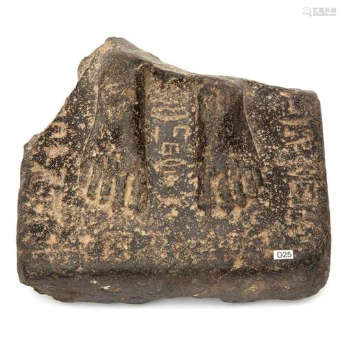 An Egyptian granite fragment of larger priest figure statue