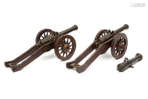 A pair of bronze miniature cannons, together with a salute cannon