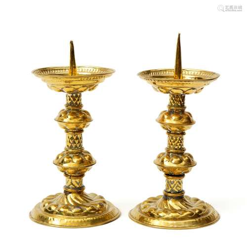 A pair of Dutch brass candlestick holders