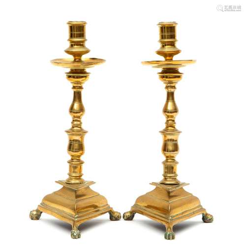 A pair of tall candlestick holders