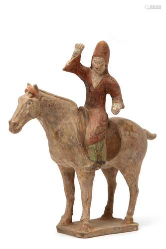 Tang dynasty terracotta figure of a horse and rider dressed in red jacket